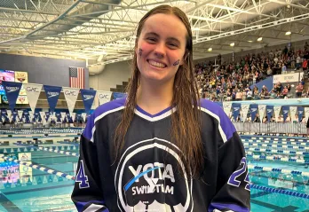 Aubrey Mitchell holding the 2026 Adolph Kiefer YMCA Youth Character Award