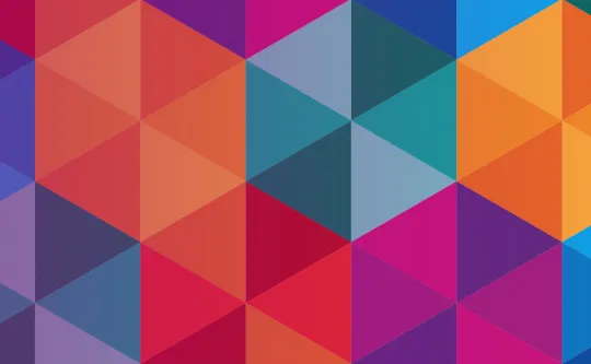 Colorful geometric background made up of triangles and diamonds in shades of red, orange, pink, blue, and purple, forming a vibrant abstract pattern.
