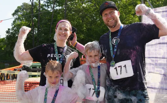 Family celebrating their finish at the Families On! race