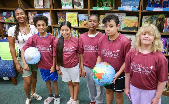 teacher and kids in the library