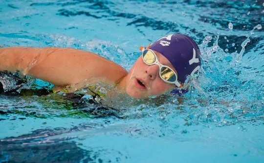 YOTA swim team swimmer in the pool