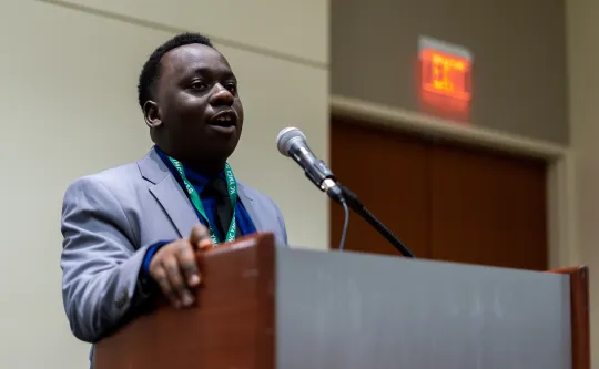 student speaking at a podium