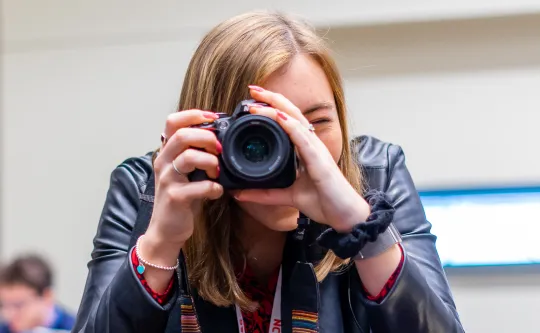 student taking a photo