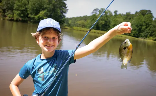 Camper fishing at Camp Kanata