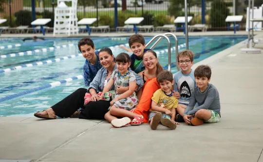 Family on the pool deck for YMCA Swim for Life