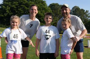 Family celebrating their finish at the Families On! race