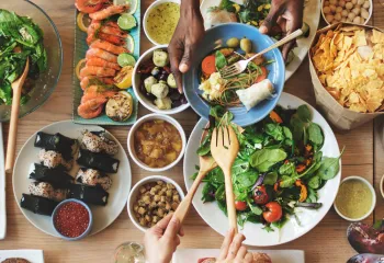 Table set with various kinds of international food dishes