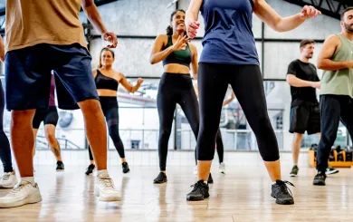 Group of people practicing line dancing