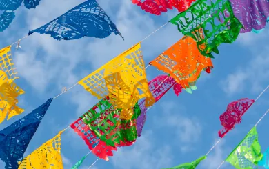 Mexican Celebration Flags against a blue sky