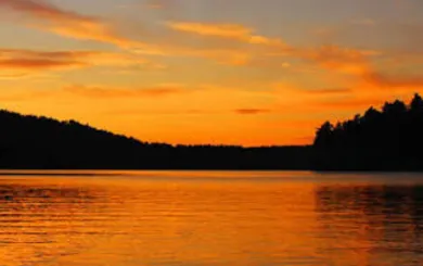 Gold yellow and orange sunset across the Jordan Lake