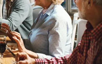 older adults at a sophisticated dinner table