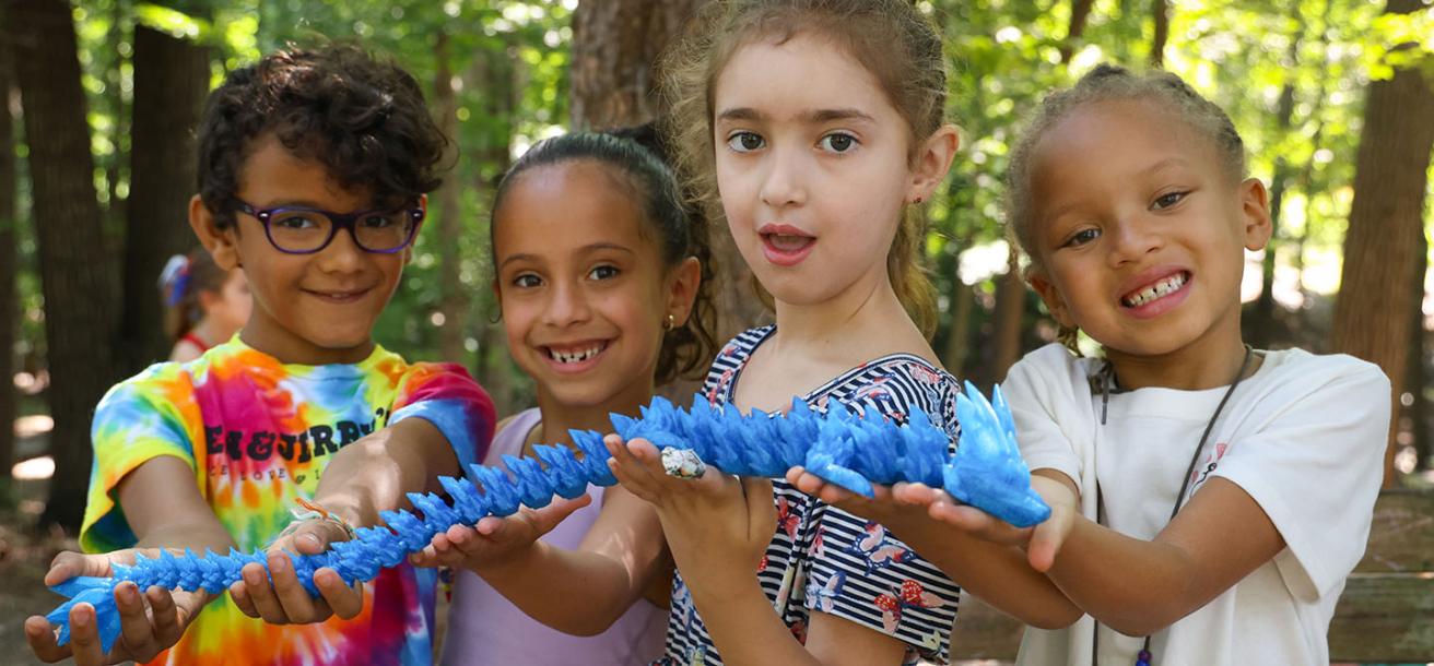 kids holding an art project