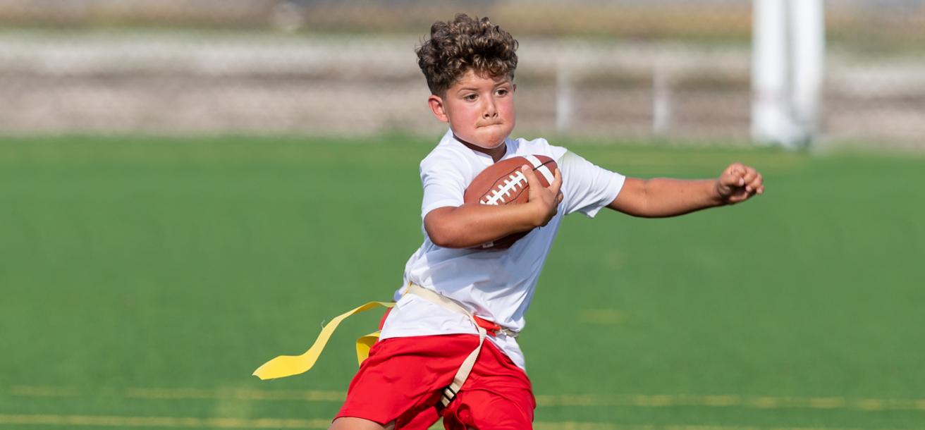 Boy playing flag football