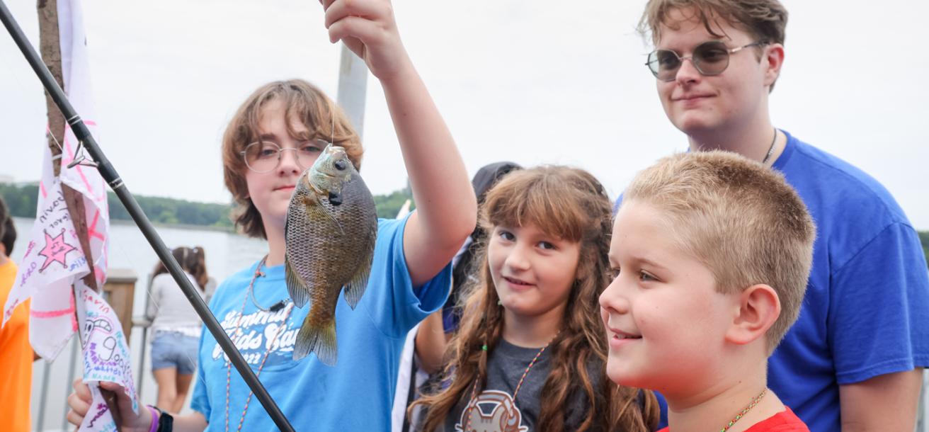 Group of kids fishing at Camp Blazing Trails
