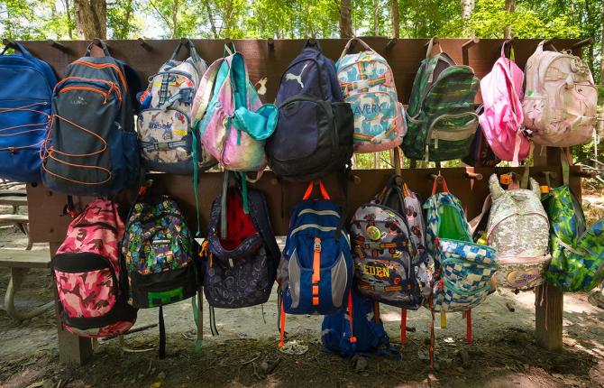 hanging structure for kids' backpacks at day camp