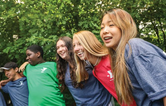 group of teens laughing together