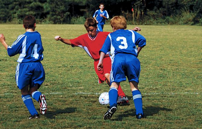 Kids participating in a soccer game