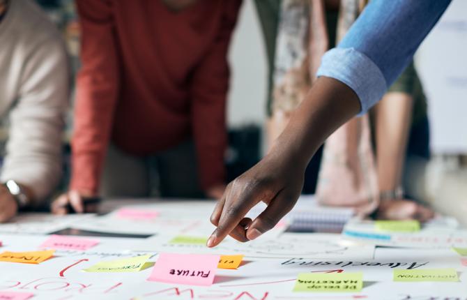 group of people reviewing a project plan